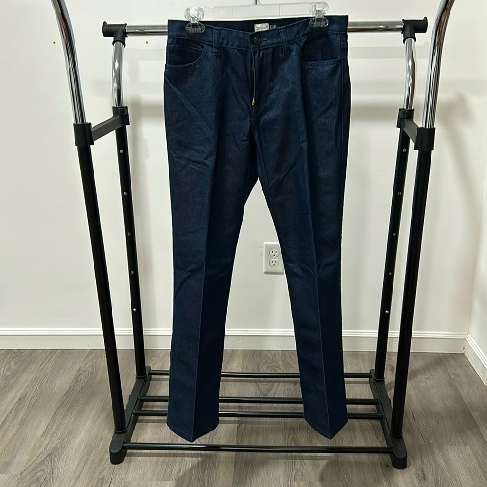 Women’s dark blue trouser jeans zippered and button in front. five pockets